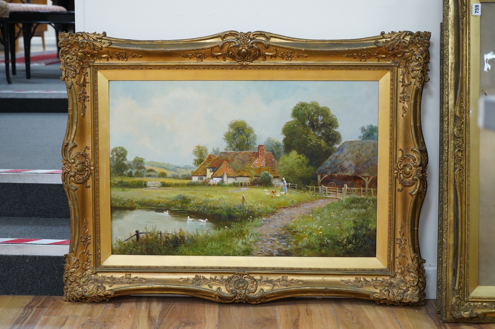 Early 20th century, English School, Figure feeding ducks beside a pond, monogrammed H B lower left, oil on canvas, 49 x 74cm, ornate gilt frame